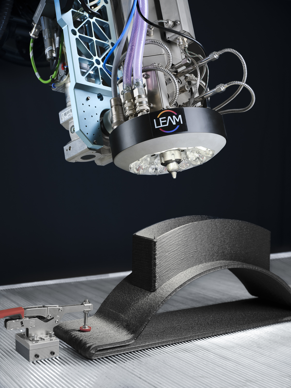 DEMEX end effector with localized heating and sensing positioned above a printed polymer part